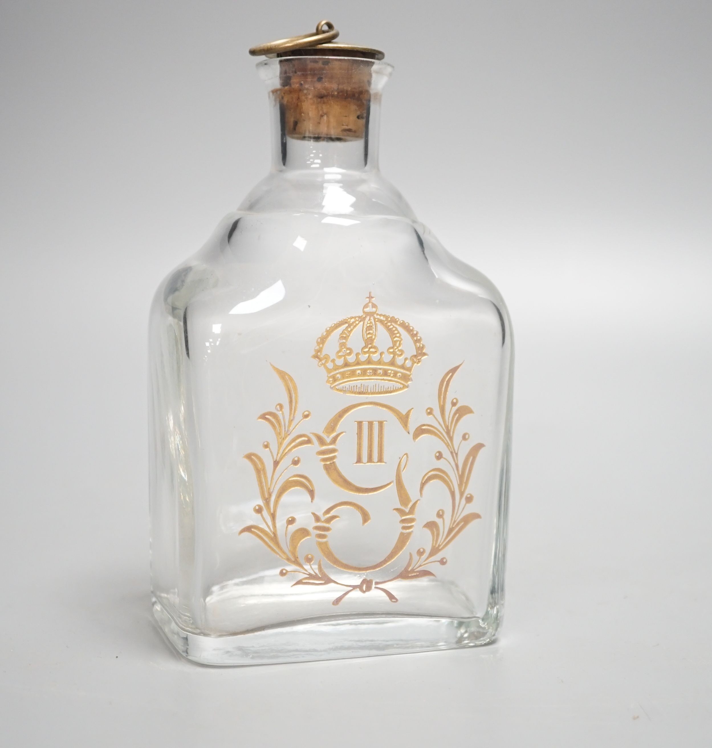 A 19th century crested glass decanter 17cm